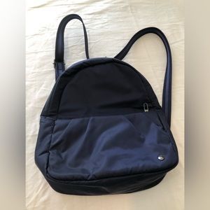 Pacsafe convertible backpack/cross body bag. Dark blue . Theft/tamper proof